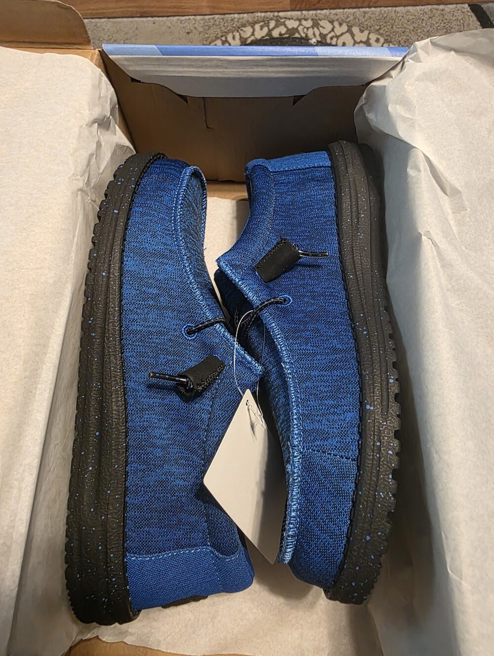 Hey Dude Men's Blue Casual Moccasin Shoes With Black Soles And Logo.